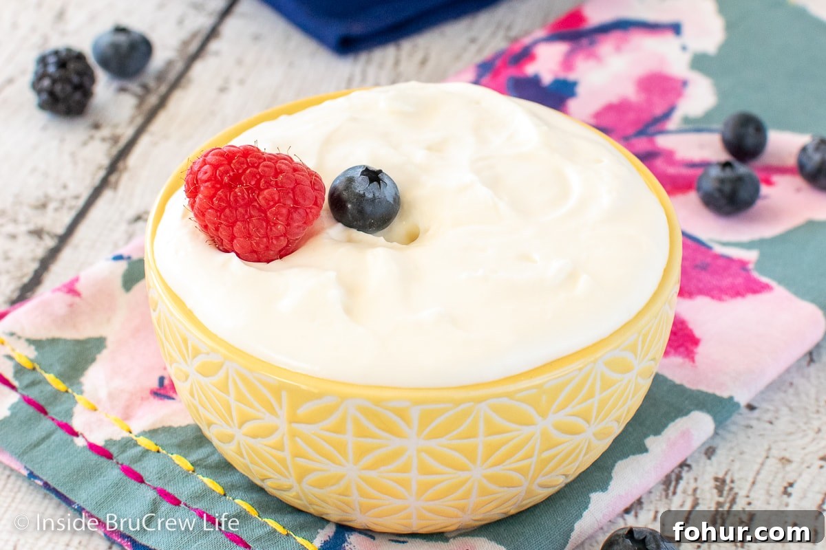 A yellow bowl filled with easy fruit dip.