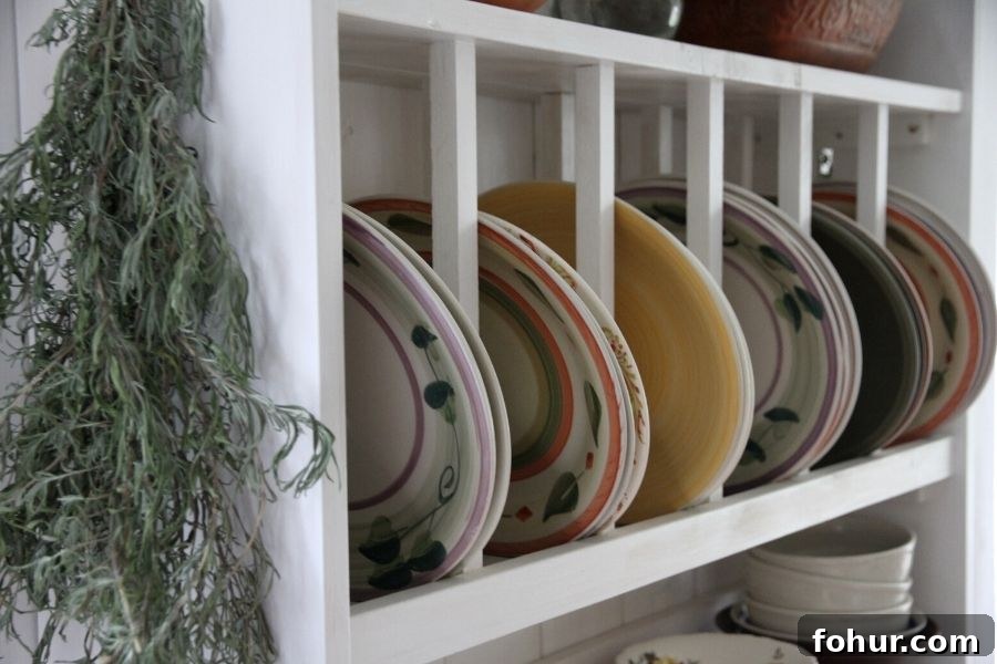 A slotted plate rack shelf filled with colorful plates