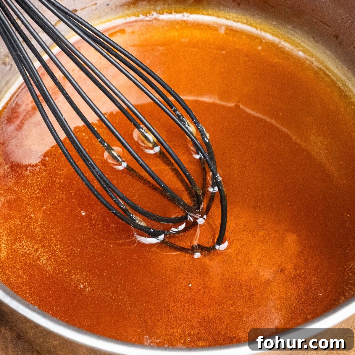 How to Make Salted Caramel Sauce 8 Amber-colour caramelised sugar in a saucepan