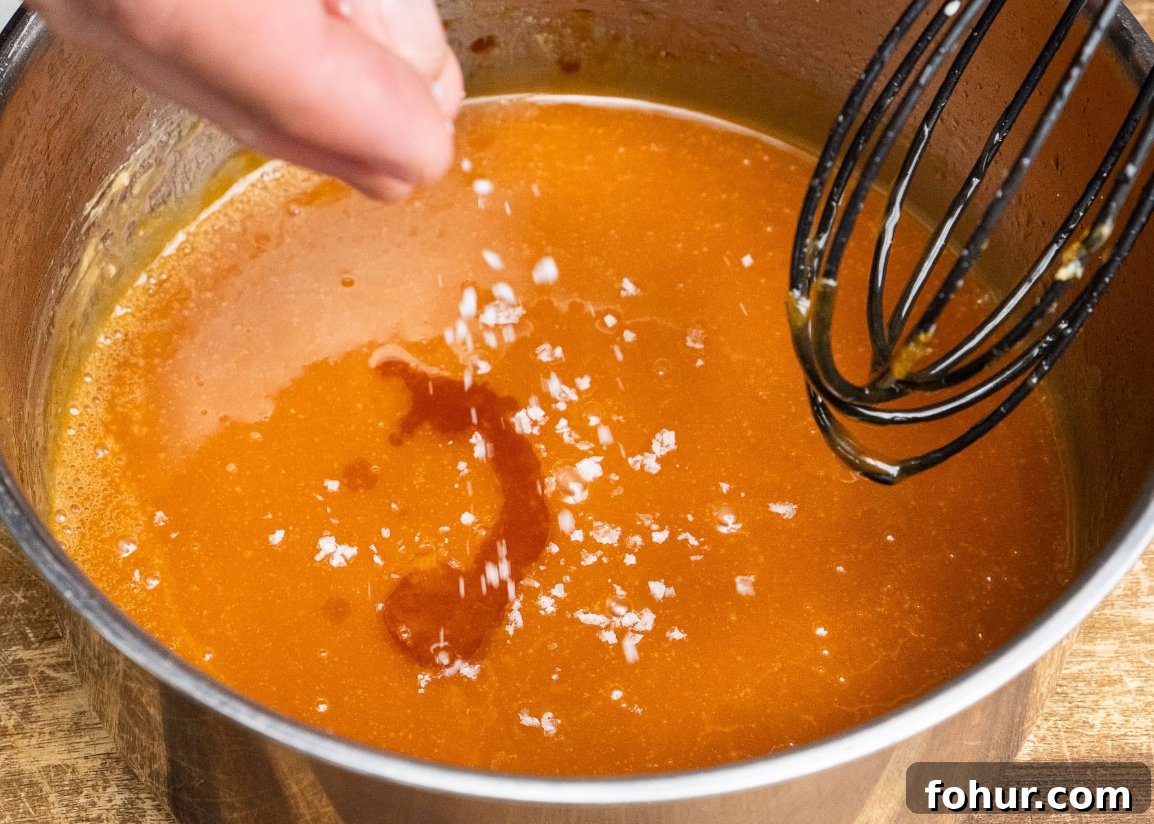 How to Make Salted Caramel Sauce 12 Sprinkling salt and adding vanilla extract to make salted caramel sauce