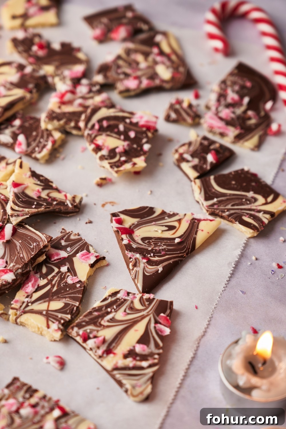 No-Bake Peppermint Bark Ready in 5 Minutes 11 Peppermint bark pieces on parchment paper.