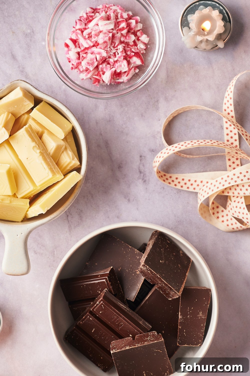 No-Bake Peppermint Bark Ready in 5 Minutes 4 A bowl of semi-sweet chocolate chunks, a bowl of white chocolate chunks and a small bowl with candy cane pieces.
