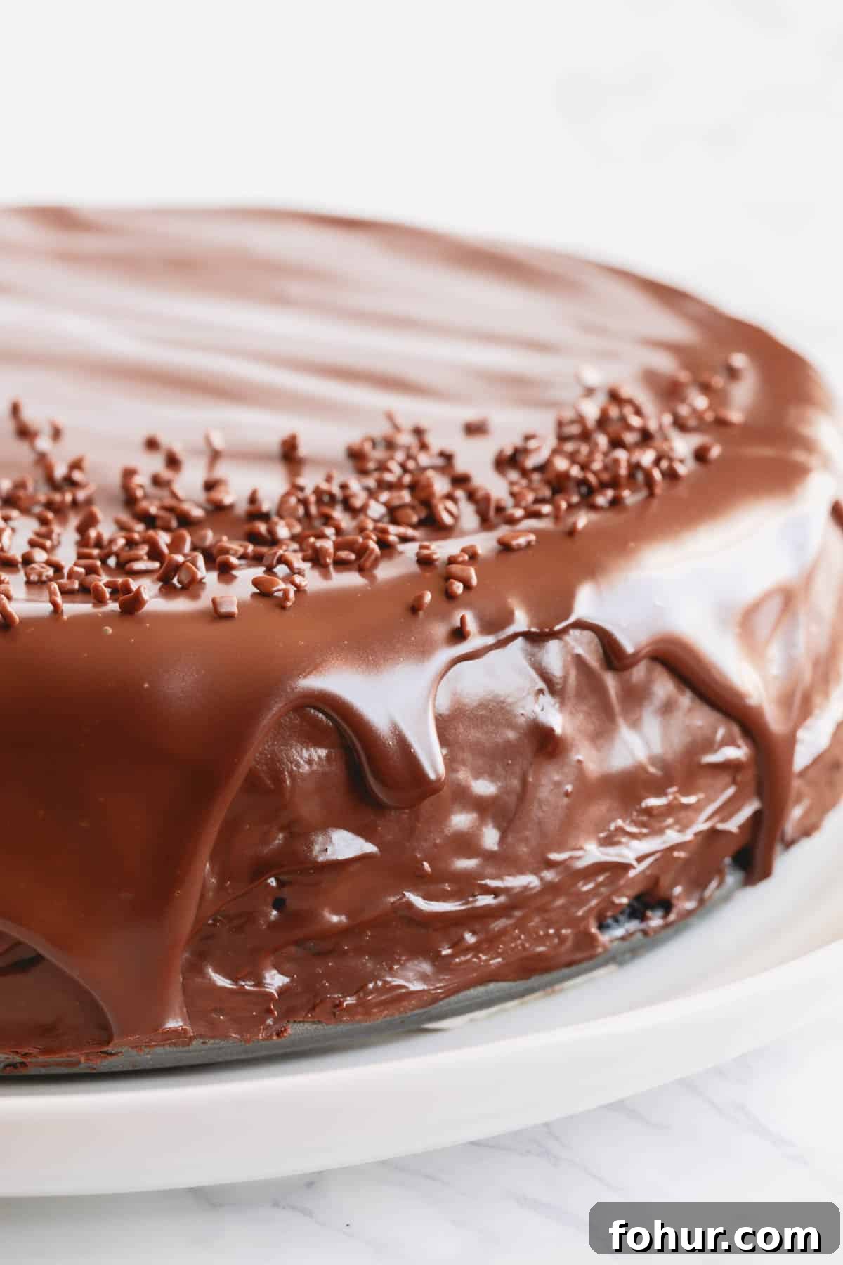 Decadent Chocolate Cheesecake Recipe with Ganache 7 A supreme chocolate cheesecake topped with chocolate ganache.