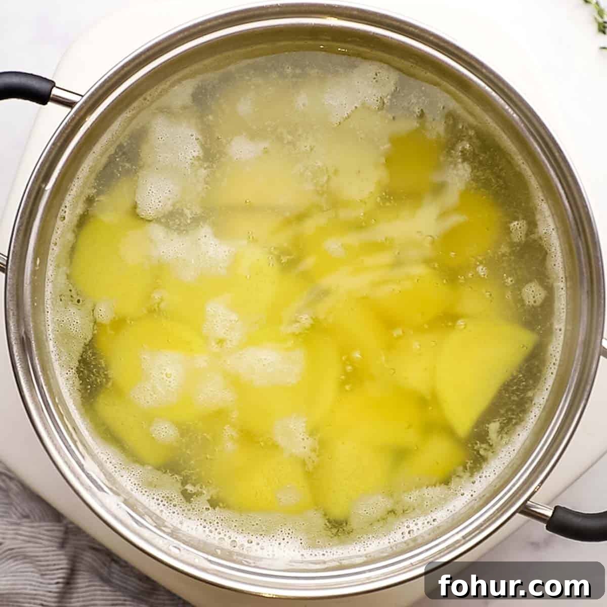 Classic British Bangers and Mash with Rich Onion Gravy 6 potatoes boiling in a pot