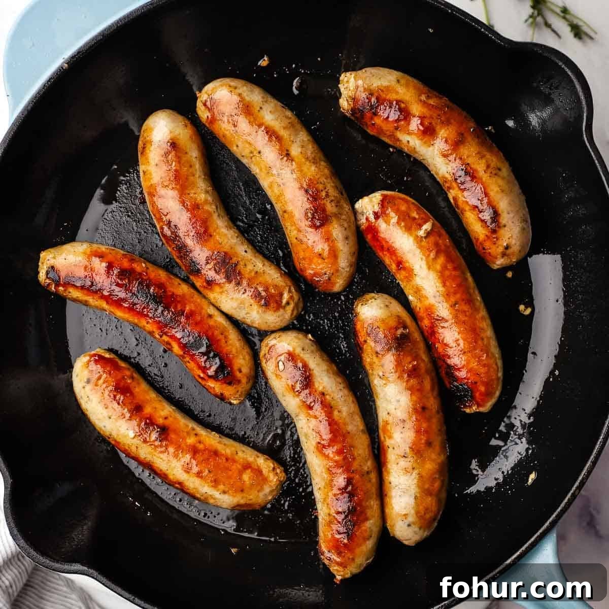 Classic British Bangers and Mash with Rich Onion Gravy 7 cooking sausages in a cast iron skillet