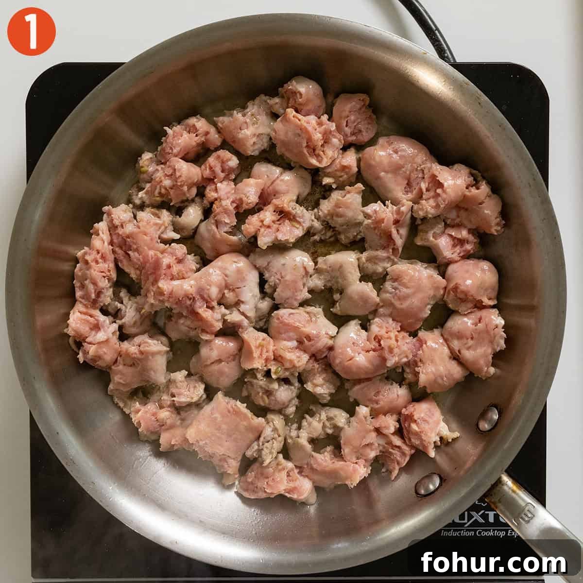Italian-Style Baked Stuffed Portobello Mushrooms 4 Frying sausage in a pan.