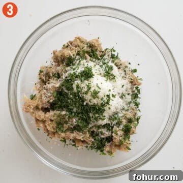Italian-Style Baked Stuffed Portobello Mushrooms 6 Combining browned sausage in a bowl with parmigiano, garlic, and parsley.