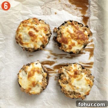 Italian-Style Baked Stuffed Portobello Mushrooms 9 Stuffed mushrooms baked on a pan.