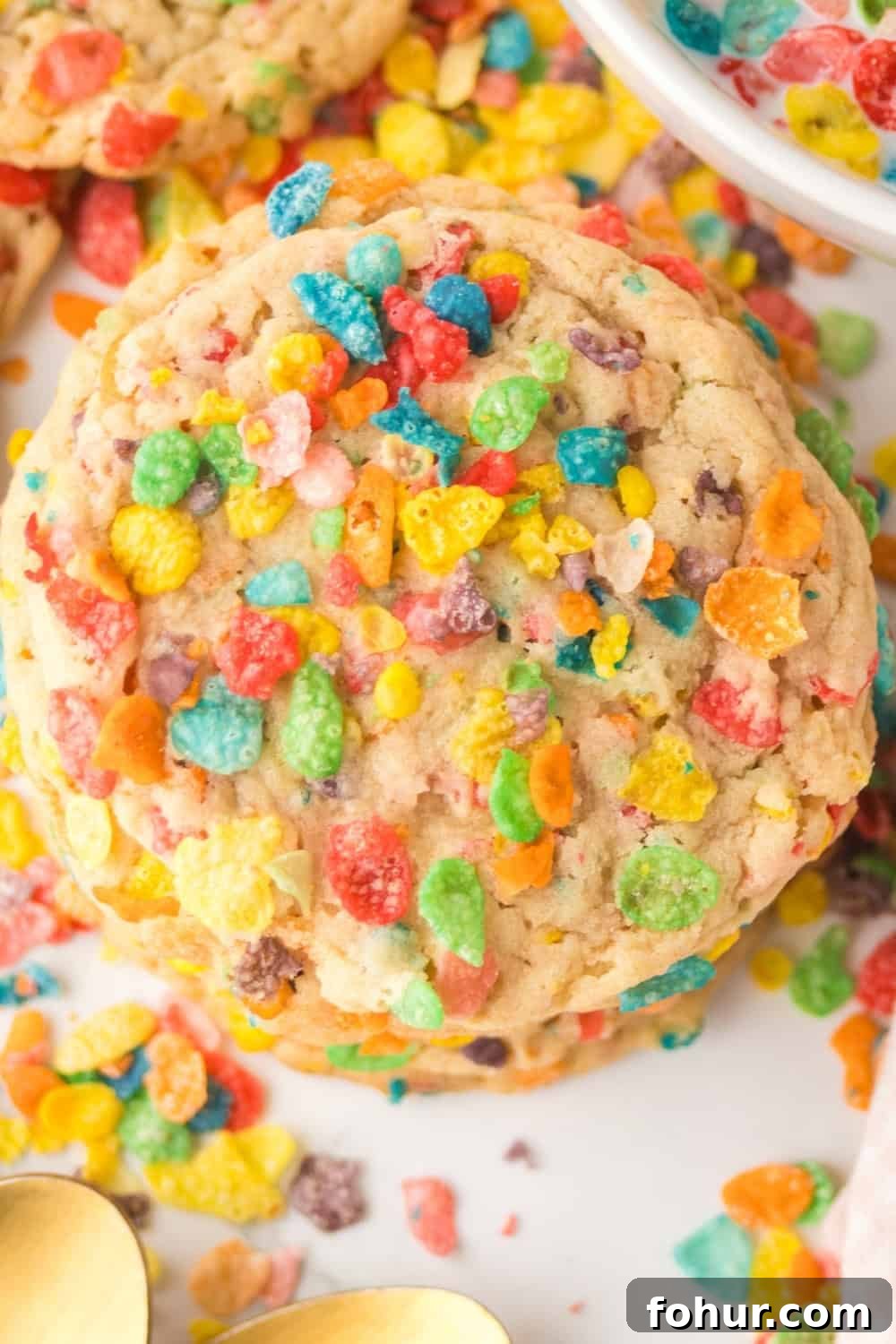 Fruity Pebbles Cookies Recipe for Crispy Colorful Treats 8 close-up overhead view of a copycat Crumbl Fruity Pebbles cookie.