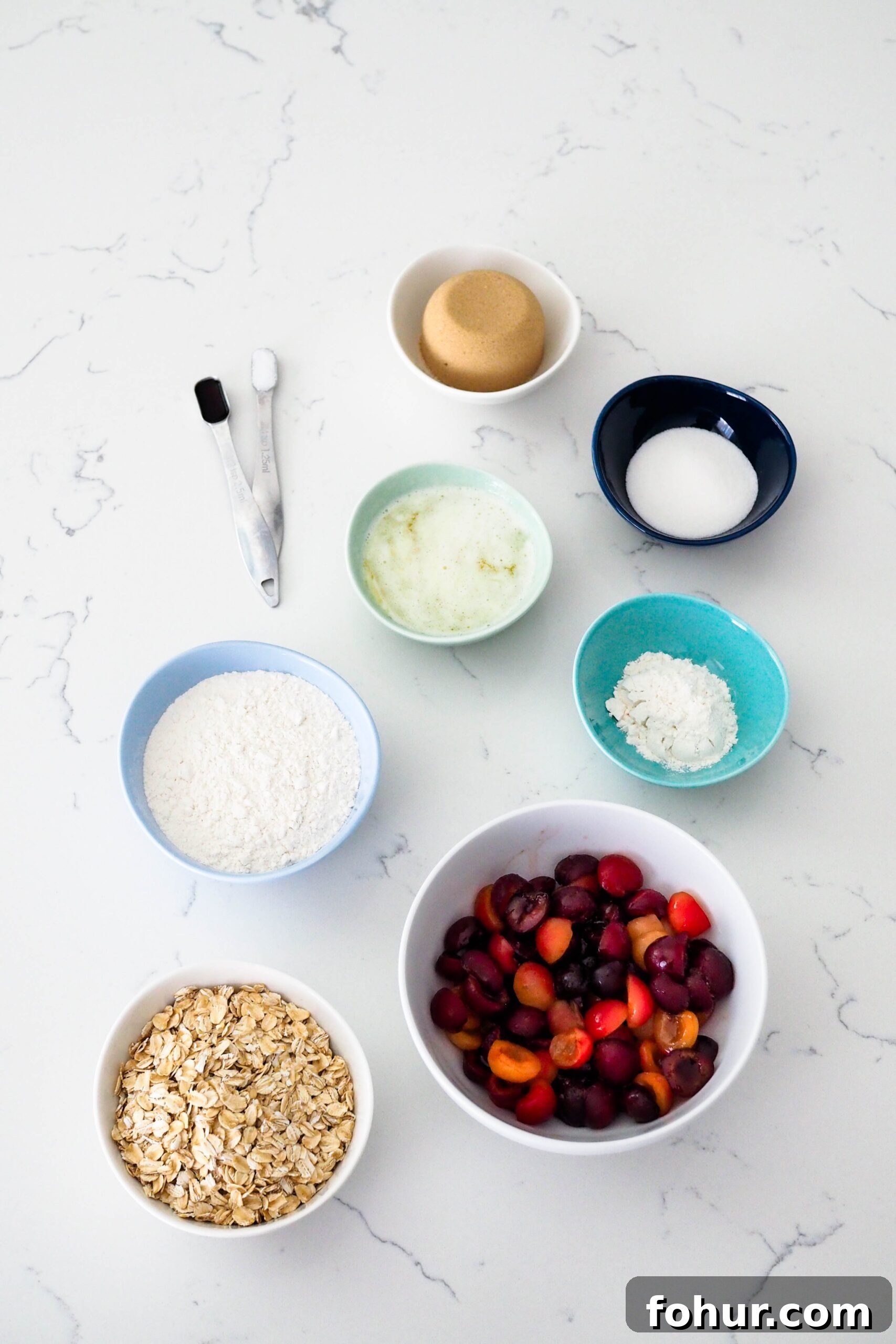 Cherry Crumble Bars with Buttery Oat Crust 3 Ingredients for cherry crumble bars laid out on a counter.