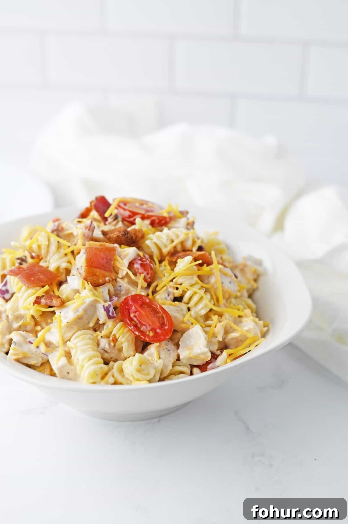 Chicken bacon pasta salad in a serving bowl.