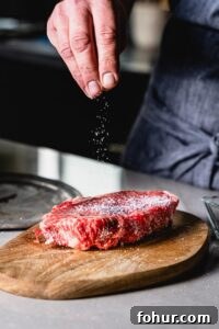 seasoning a new york strip steak with salt