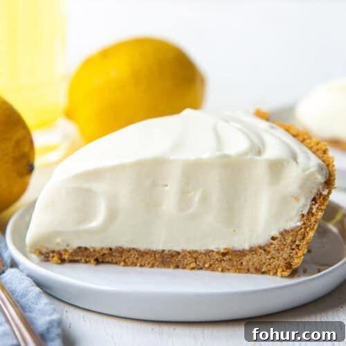 slice of lemonade pie with graham cracker crust.