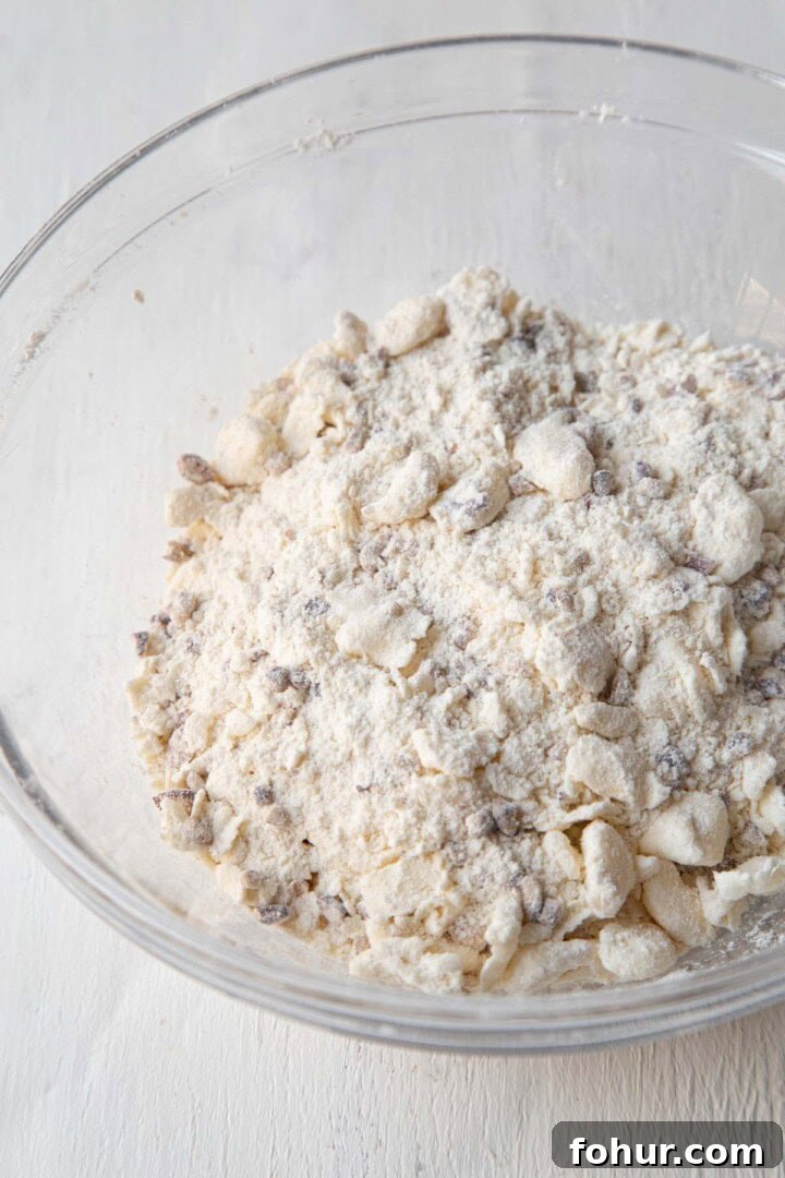 flour, pecans, and butter in a glass bowl.