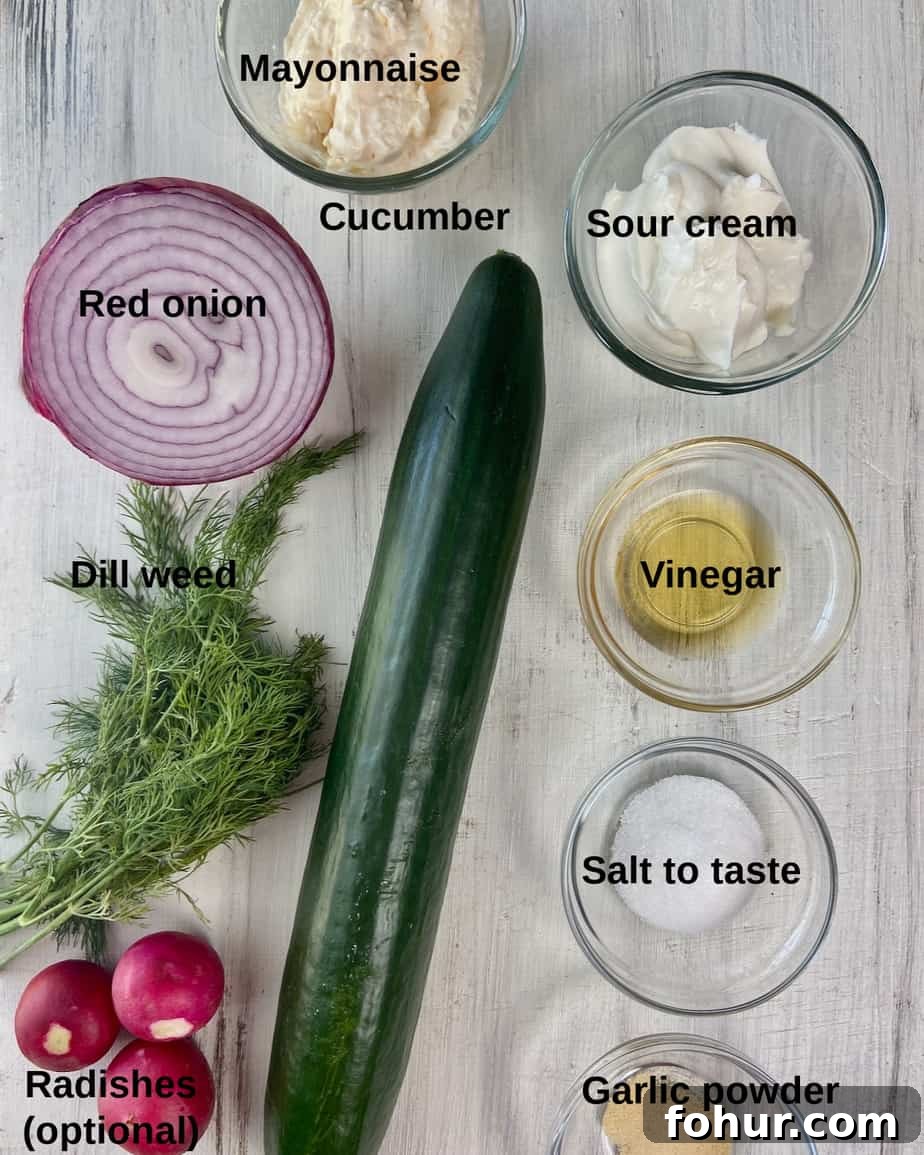 Creamy Cucumber Salad with Greek Yogurt and Dill 3 Ingredients labeled on a white table.