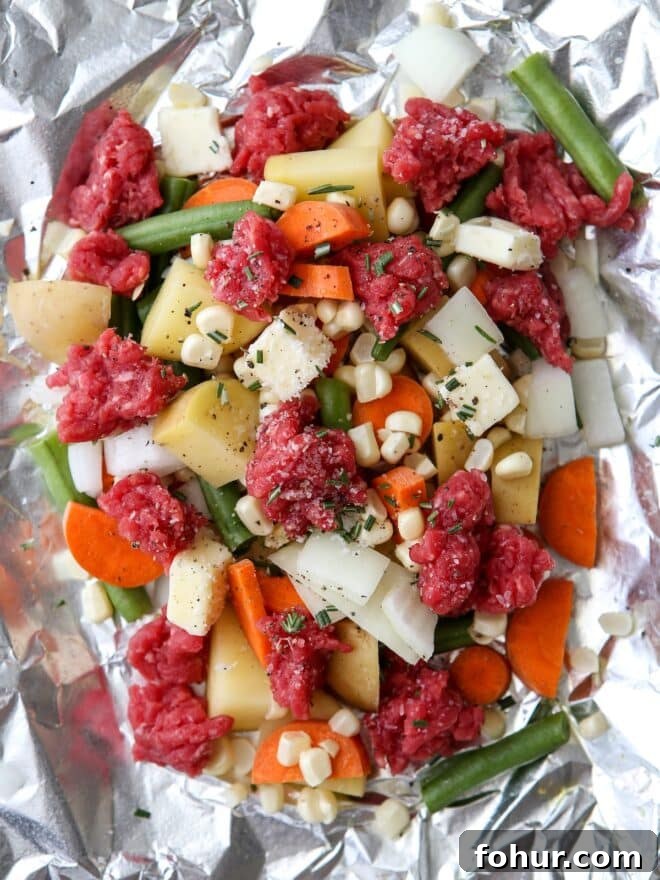 These beef and veggie tin foil dinners are an entire meal wrapped up in foil and cooked on the grill, over a fire, or in the oven.
