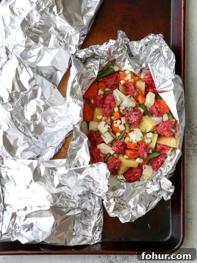 These beef and veggie tin foil dinners are an entire meal wrapped up in foil and cooked on the grill, over a fire, or in the oven.