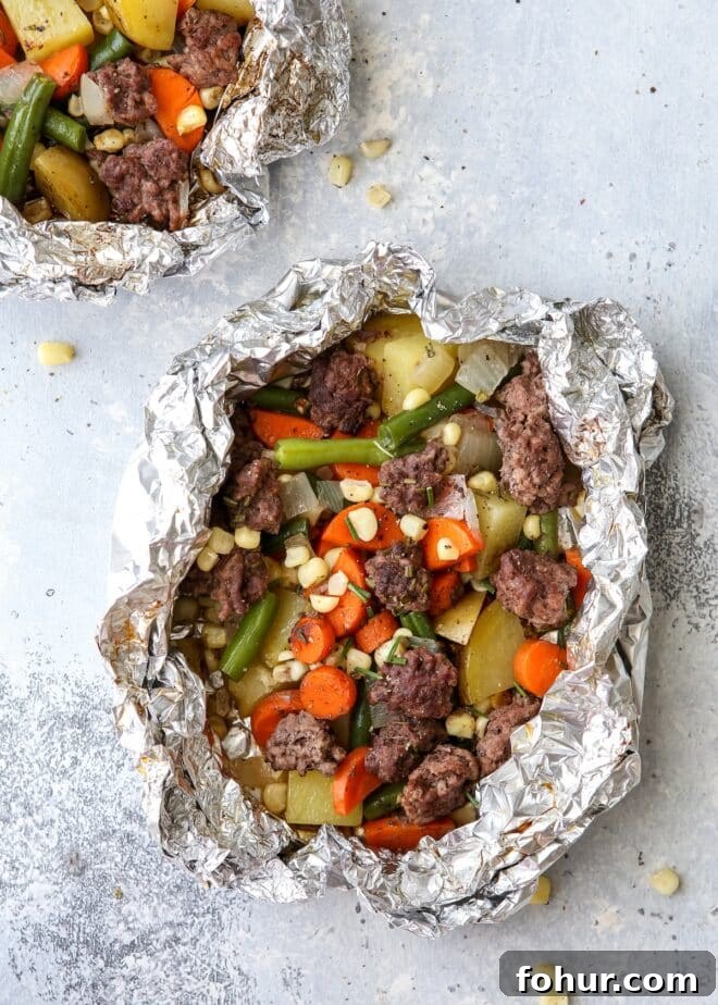 These beef and veggie tin foil dinners are an entire meal wrapped up in foil and cooked on the grill, over a fire, or in the oven.