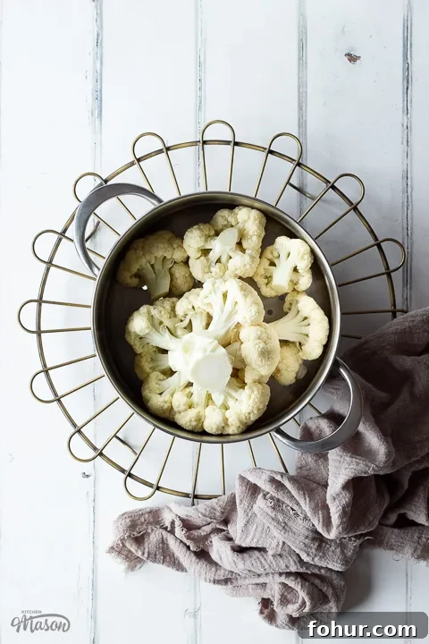 How to Cook Cauliflower: Roast, Steam, Saute and More 6 Prepared cauliflower in a steamer basket