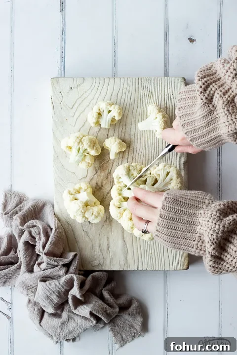 How to Cook Cauliflower: Roast, Steam, Saute and More 3 Someone chopping cauliflower on a board