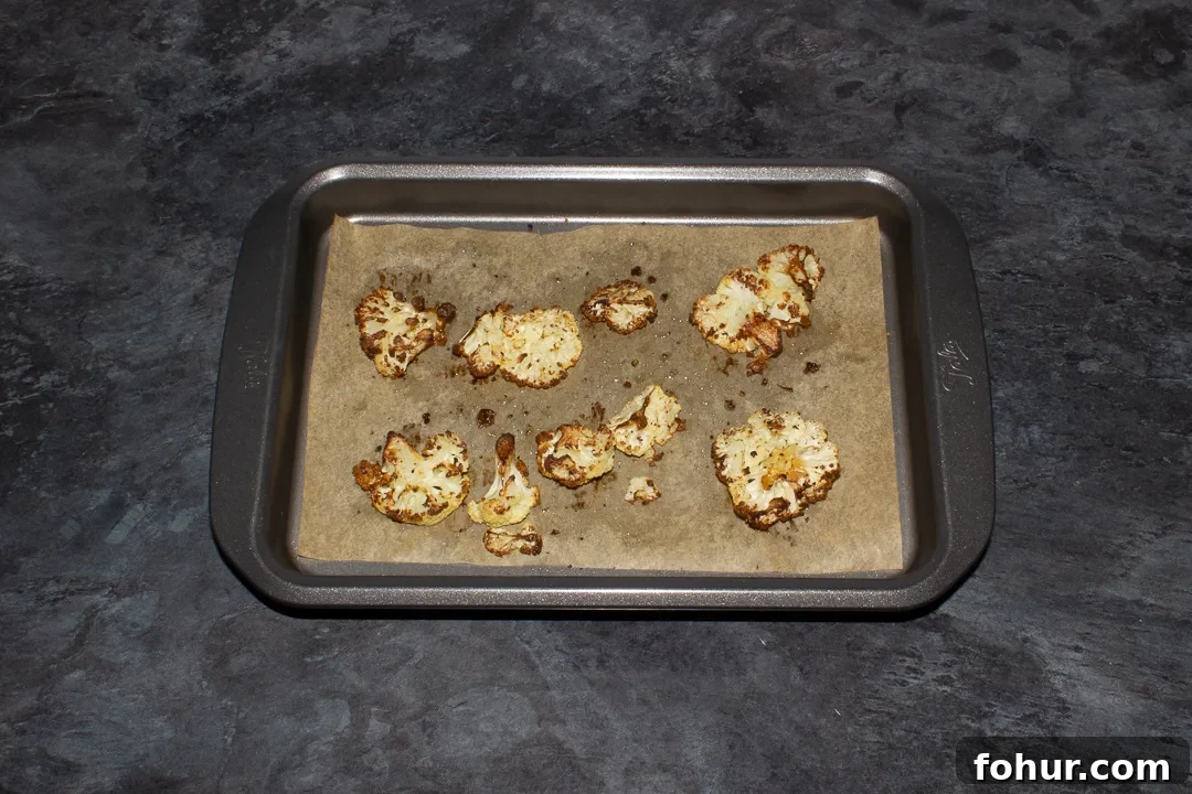 How to Cook Cauliflower: Roast, Steam, Saute and More 8 Oven roasted cauliflower on a lined baking tray