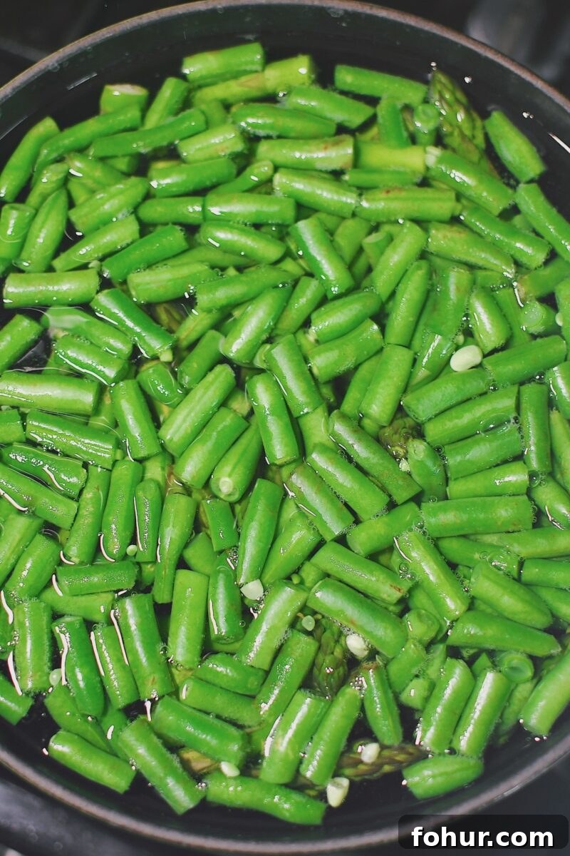 Creamy Green Goddess Potato Salad Recipe 4 Cooking green beans and asparagus in a pot of boiling water till just warmed, before cooking the potatoes in the same pot.