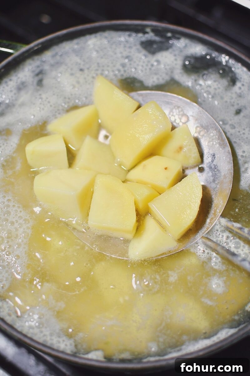 Creamy Green Goddess Potato Salad Recipe 7 Cooking the potatoes in boiling water till tender.