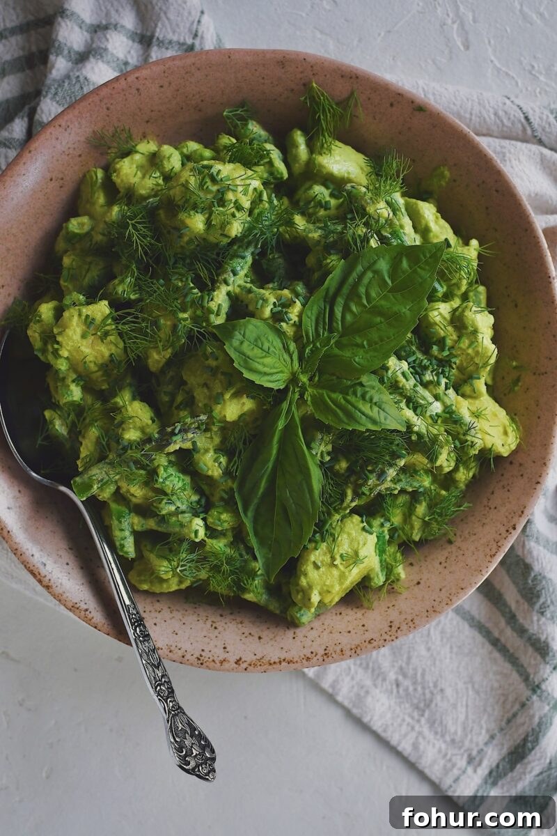 Creamy Green Goddess Potato Salad Recipe 9 Green Goddess Potato Salad in a serving bowl on a table.