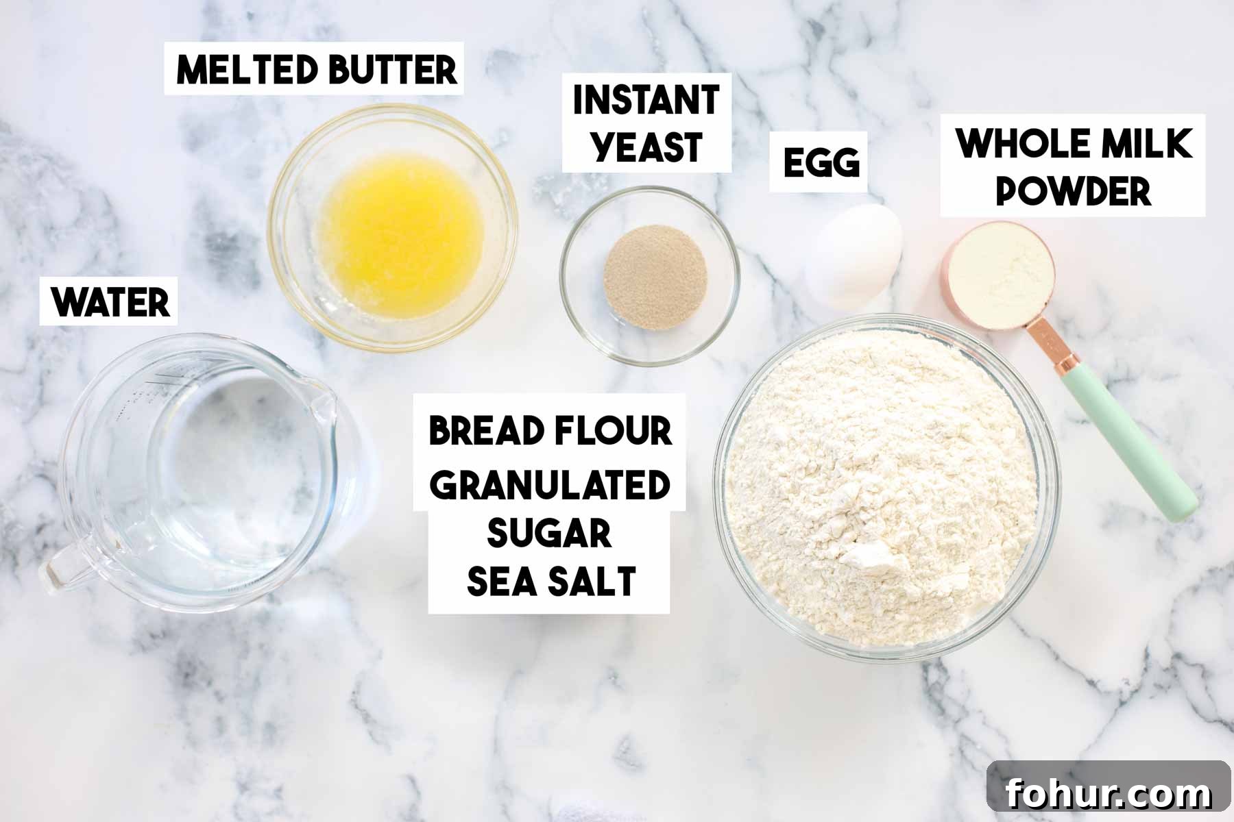 How to Make Brioche Hot Dog Buns from Scratch 4 Ingredients for hot dog buns arranged on a surface.