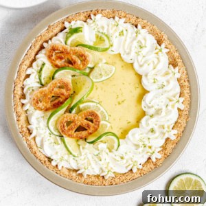 Classic Key Lime Pie Recipe with Graham Cracker Crust 8 Key lime pie on white stucco background.