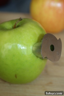 Use a heart cookie cutter to make a heart. heart cutter green apple