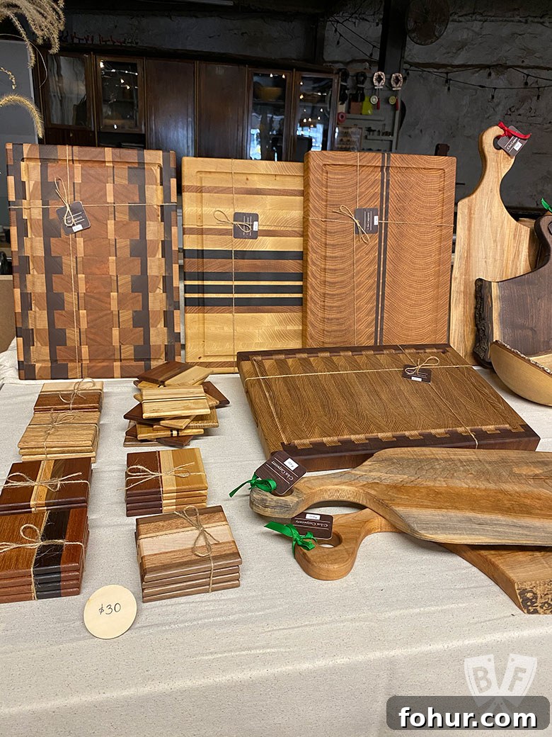 Shop Small Holiday Gift Guide 2020: Big Flavors, Part 2 9 Display of handmade wood cheeseboards and coasters from C.los Carpentry.