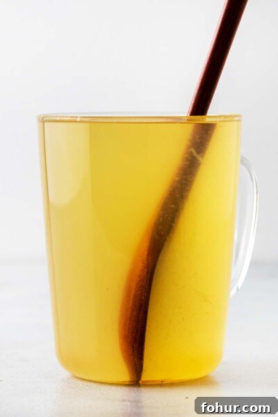 How to Make Homemade Lemon Tea: Fresh Citrus Recipe 5 Stirring lemon tea.