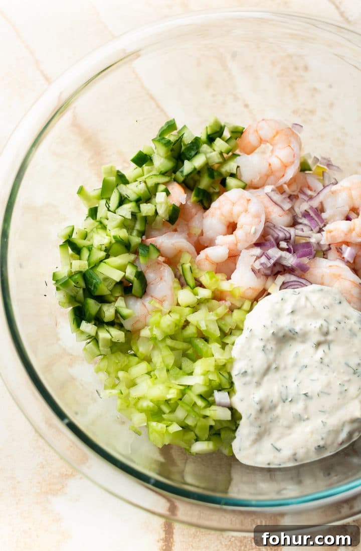 Zesty Shrimp Salad Recipe with Avocado and Lime Dressing 3 shrimp salad ingredients in a glass prep bowl