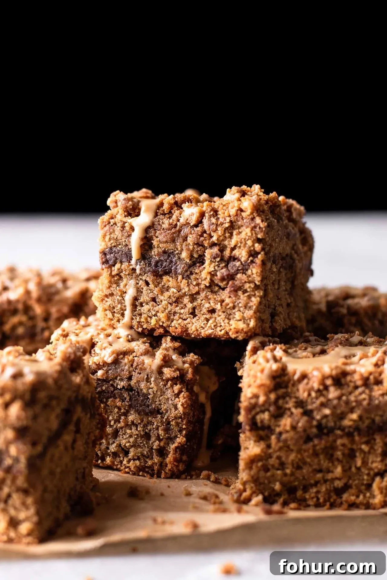 actual coffee coffee cake slices stacked on parchment paper (1)