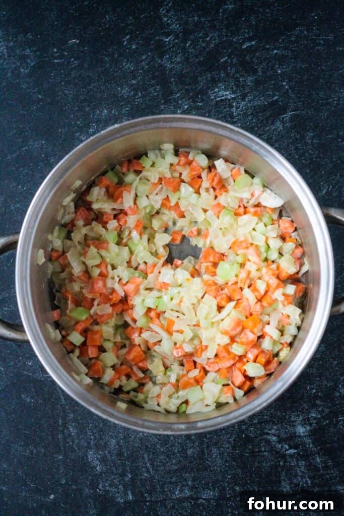 Curried Carrot and Lentil Soup Recipe 5 Sautéed diced onions, celery, and carrots in a soup pot.