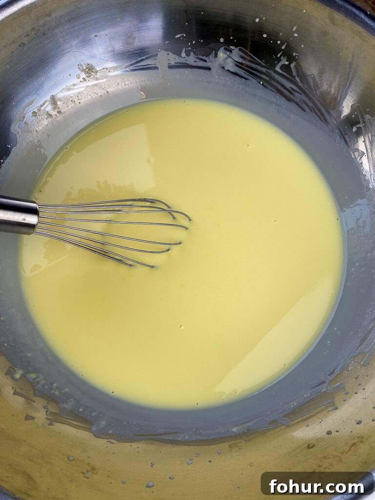 Dirt Cake Recipe to Feed a Crowd 6 Instant vanilla pudding with a whisk in it mixed up in a 30 quart mixing bowl to make a big batch dessert for a crowd