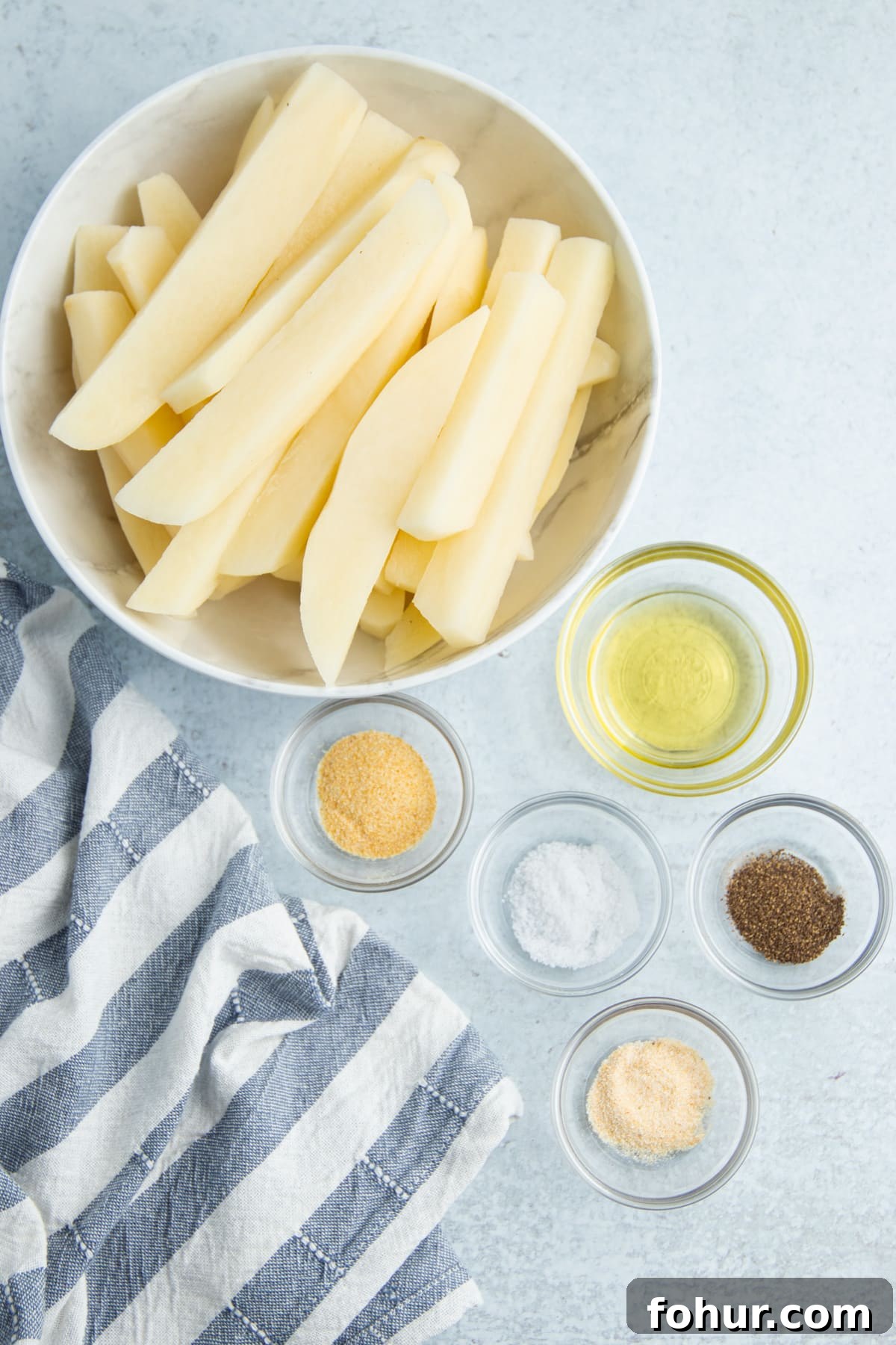 Crispy Air Fryer Steak Fries Recipe 4 Picture of all ingredients in individual bowls.