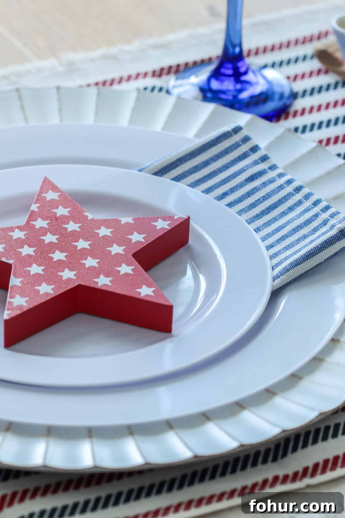 4th of July Tablescape Ideas for Festive Patriotic Decor 12 Close up of place setting with red star.