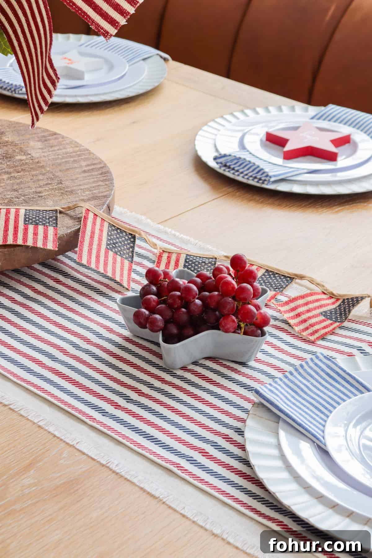 4th of July Tablescape Ideas for Festive Patriotic Decor 13 Patriotic tablesetting with red grapes in star dish.