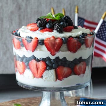 Red white blue layered cake trifle with cream cheese and whipped cream filling.