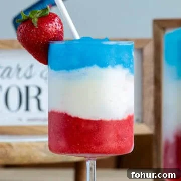 Fourth of July drink with red white and blue layers.