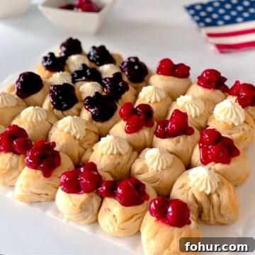 patriotic American flag dessert with red, white and blue topping on biscuits.