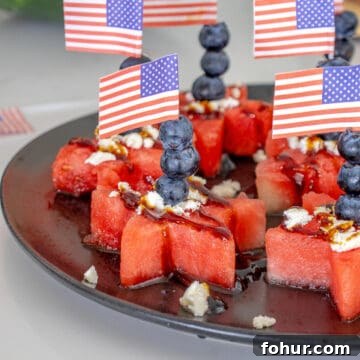 Watermelon stars appetizer with blueberries and feta cheese.