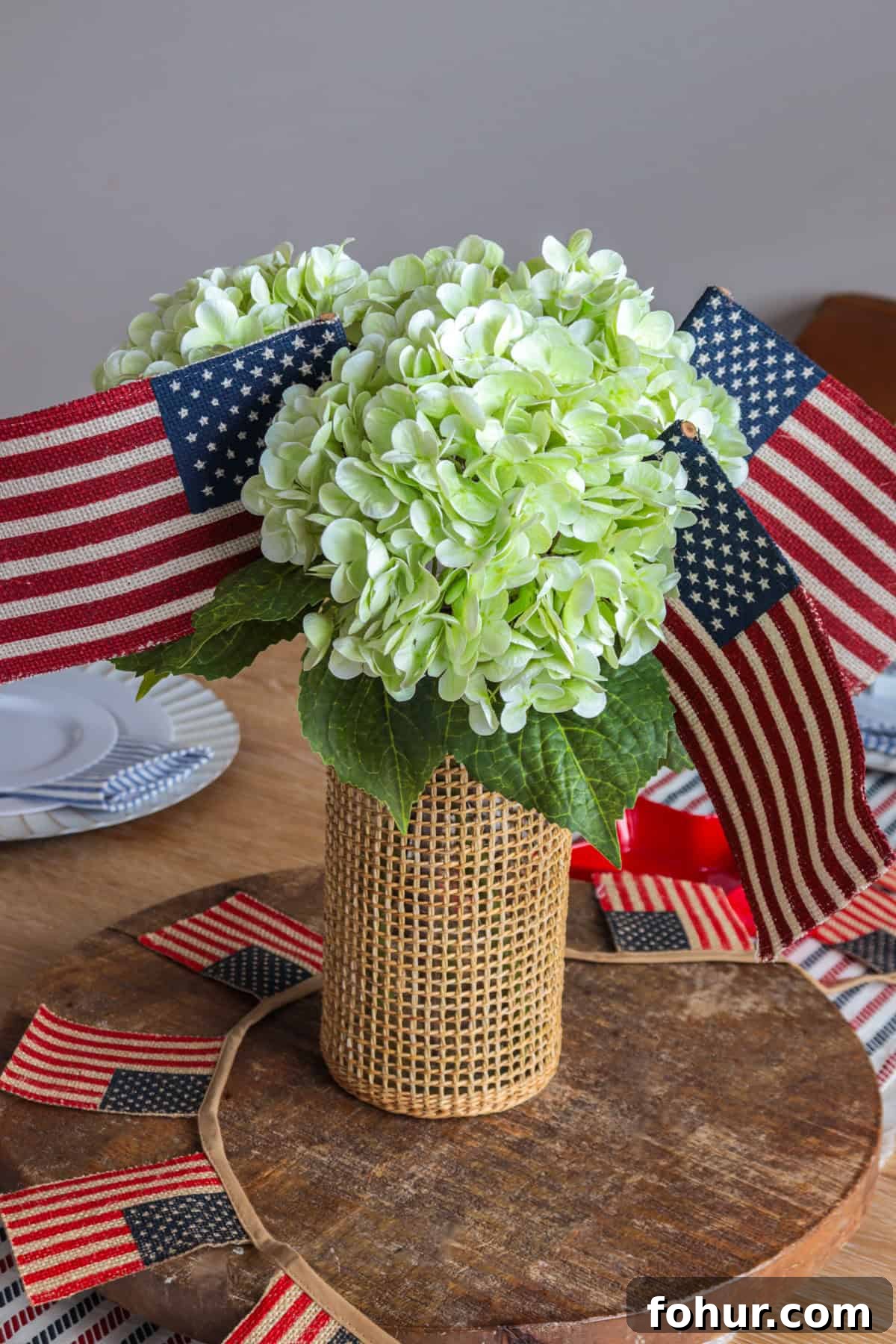 4th of July Tablescape Ideas for Festive Patriotic Decor 7 Hydrangea and American flag centerpiece.