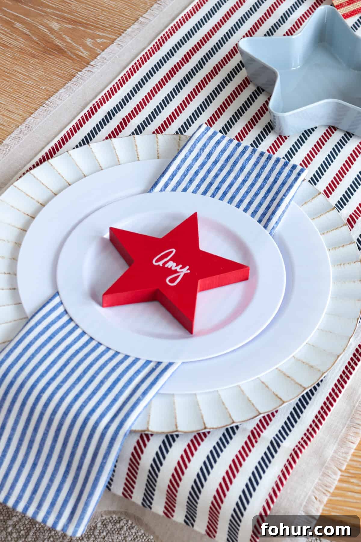 4th of July Tablescape Ideas for Festive Patriotic Decor 9 Place setting with red star and name written on it.