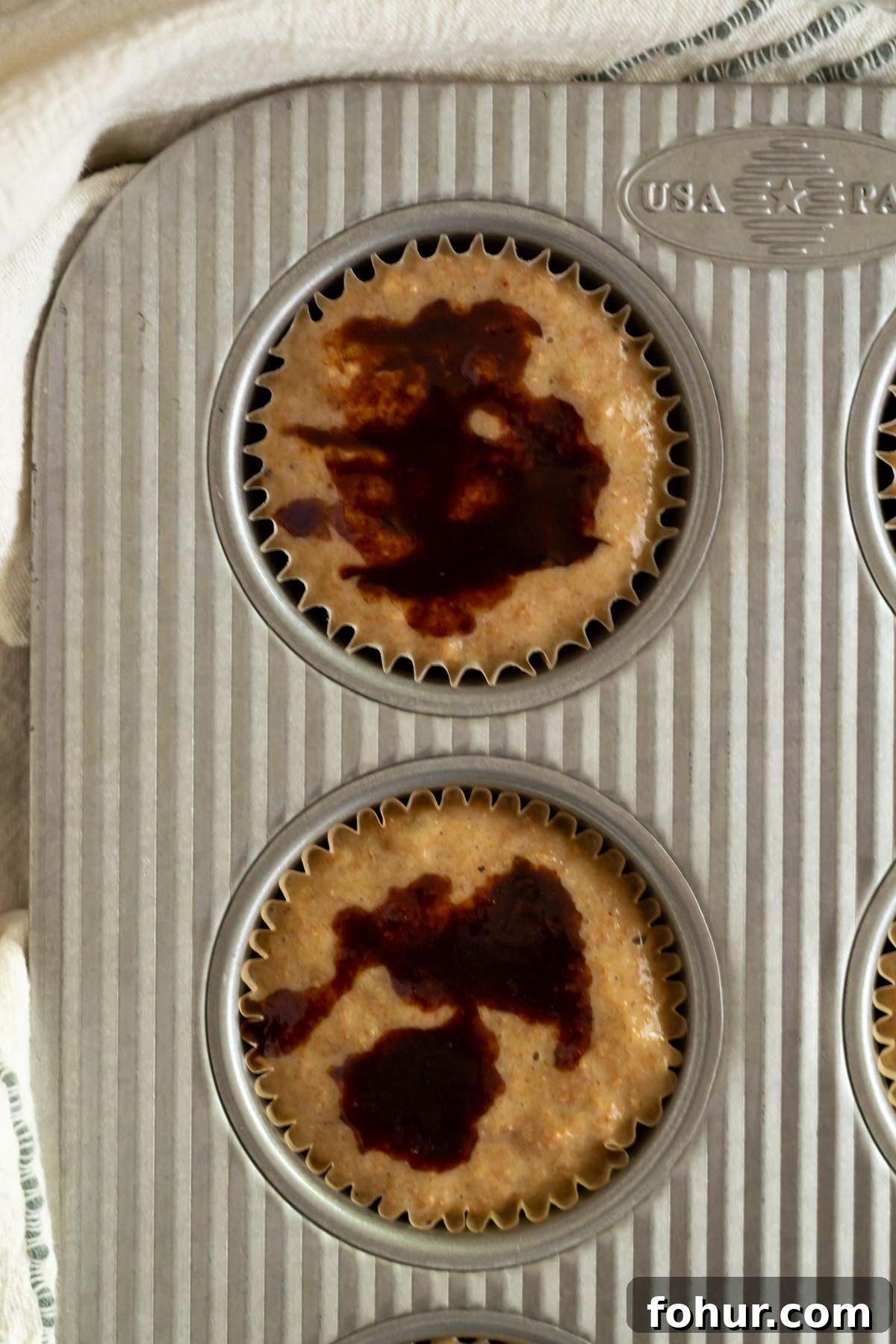Small-Batch Banana Muffins Recipe (Makes 6) 5 cinnamon sugar on top of muffin batter in a muffin tin