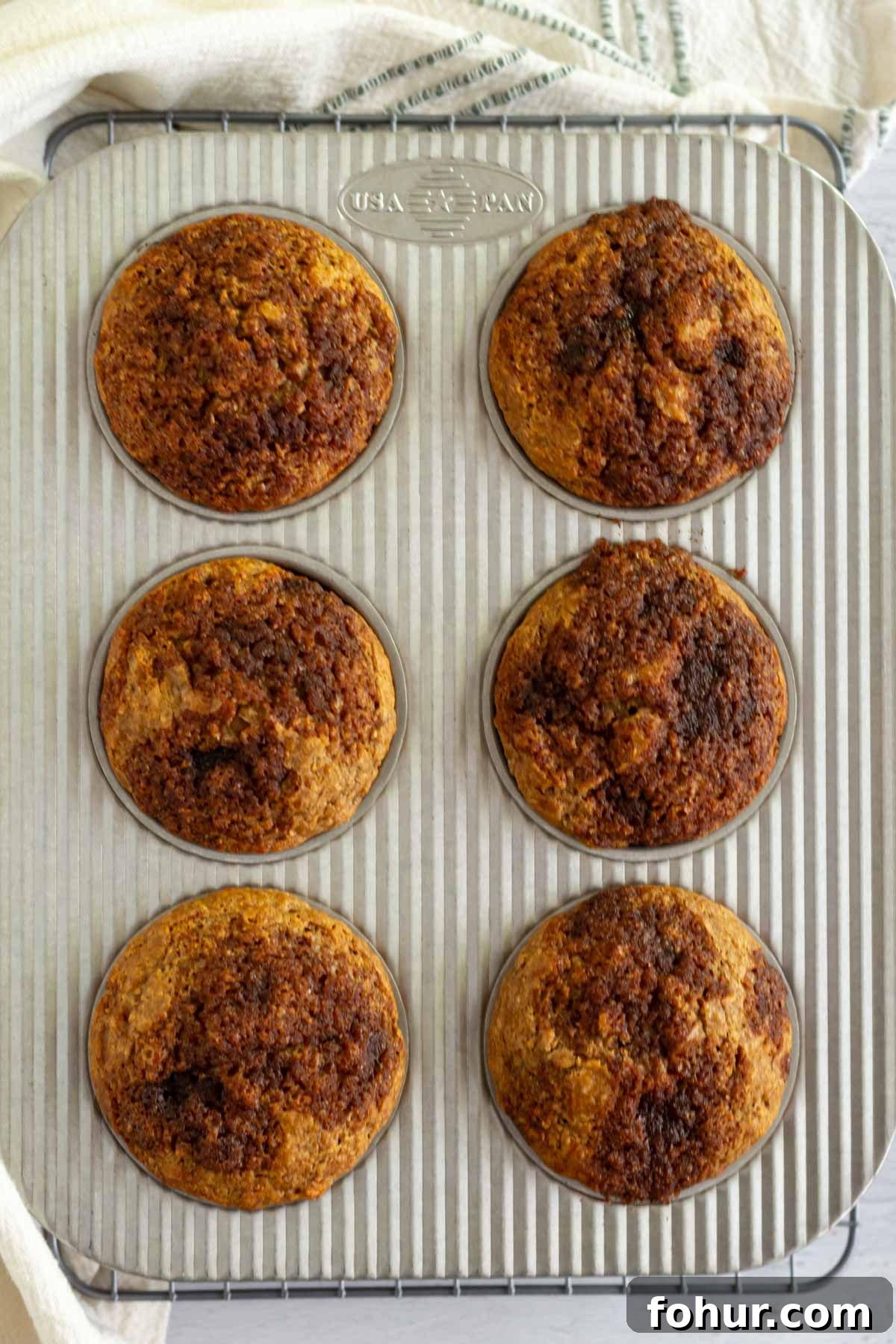 Small-Batch Banana Muffins Recipe (Makes 6) 6 baked muffins in a muffin tin