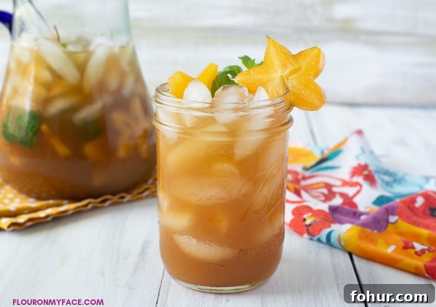 February Seasonal Produce: What Is Fresh Now 7 A close up photo of a glass full of freshly made Carambola Iced Tea Cooler