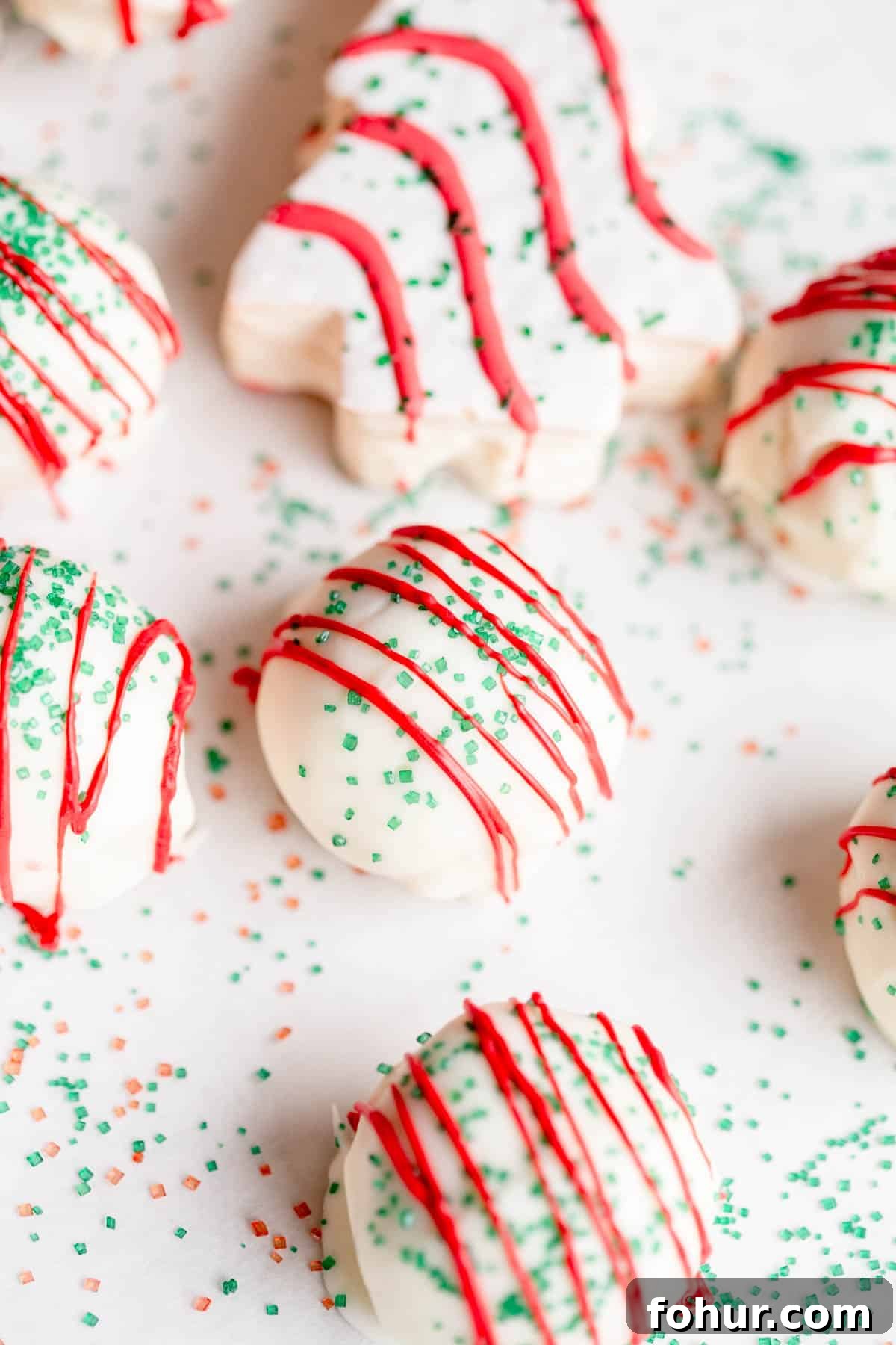 Little Debbie Christmas Tree Cake Pops Recipe 5 Little Debbie Christmas Tree Cake Pops on a baking sheet